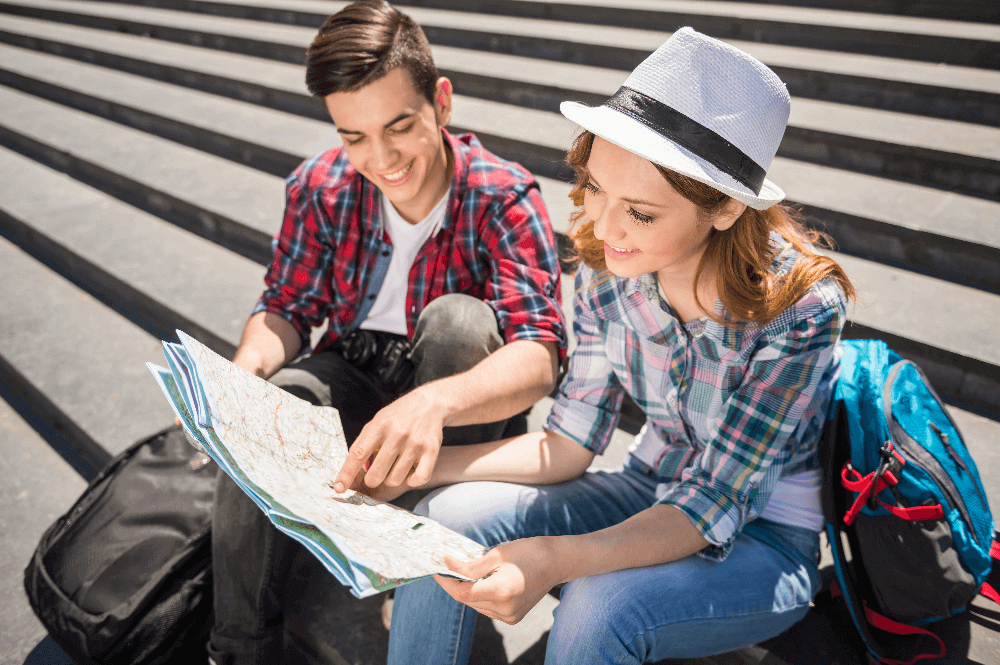 Two young people travelplanning